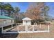 Small garden area with white fence and a shed at 4785 Old Douglasville Rd, Lithia Springs, GA 30122