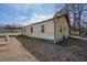 Side view of a yellow ranch home with a green roof at 4785 Old Douglasville Rd, Lithia Springs, GA 30122