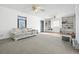 Living room with built-in shelves and ceiling fans at 4785 Old Douglasville Rd, Lithia Springs, GA 30122