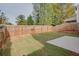 Fenced backyard with grassy area and patio at 5138 Mcever View Dr, Sugar Hill, GA 30518