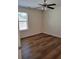 Bedroom with ceiling fan and laminate wood flooring at 5138 Mcever View Dr, Sugar Hill, GA 30518