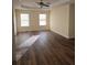 Spacious bedroom with dark laminate wood flooring and ceiling fan at 5138 Mcever View Dr, Sugar Hill, GA 30518