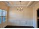 Formal dining room with tray ceiling and chandelier at 5138 Mcever View Dr, Sugar Hill, GA 30518