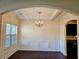 Formal dining room with tray ceiling and chandelier at 5138 Mcever View Dr, Sugar Hill, GA 30518