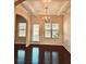 Formal dining room with tray ceiling and chandelier at 5138 Mcever View Dr, Sugar Hill, GA 30518