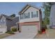 Two-story house with brick and siding exterior, two-car garage, and landscaping at 5138 Mcever View Dr, Sugar Hill, GA 30518