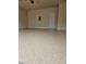 Spacious garage with epoxy floor and ample storage space at 5138 Mcever View Dr, Sugar Hill, GA 30518