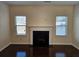 Living room with fireplace and hardwood floors at 5138 Mcever View Dr, Sugar Hill, GA 30518