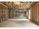 Open unfinished basement with framed rooms at 1645 Mayfield Rd, Alpharetta, GA 30009