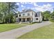 Beautiful farmhouse exterior with welcoming front porch at 1645 Mayfield Rd, Alpharetta, GA 30009