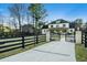 Stunning two-story home with gated entry and expansive lawn at 1645 Mayfield Rd, Alpharetta, GA 30009