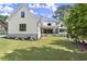 White two-story farmhouse with a covered patio at 1645 Mayfield Rd, Alpharetta, GA 30009