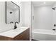 Modern bathroom featuring a sleek vanity with a stylish faucet, showerhead, and a soaking tub at 1956 Gober Se Ave, Smyrna, GA 30080