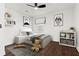Stylishly furnished bedroom with hardwood floors, ceiling fan, and decorative wall art at 1956 Gober Se Ave, Smyrna, GA 30080