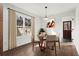 Bright dining room features a round table with four chairs, light-colored walls, and a view to the backyard at 1956 Gober Se Ave, Smyrna, GA 30080