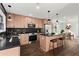 Modern kitchen features stainless steel appliances, a kitchen island with barstool seating, and modern lighting at 1956 Gober Se Ave, Smyrna, GA 30080