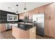Spacious kitchen with stainless steel appliances, an island, and plenty of cabinets for storage makes cooking enjoyable at 1956 Gober Se Ave, Smyrna, GA 30080