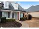 Home's entrance with a covered porch and landscaping at 23 Spring Folly Nw, Cartersville, GA 30121