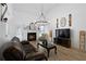 Living room with fireplace, chandelier, and hardwood floors at 23 Spring Folly Nw, Cartersville, GA 30121
