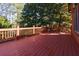 Outdoor wooden deck area surrounded by lush trees offering plenty of shade at 3340 Switchbark Ln, Alpharetta, GA 30022