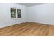 Bright basement room featuring a window and wood-look flooring at 3340 Switchbark Ln, Alpharetta, GA 30022