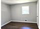 Simple bedroom with hardwood floors and neutral walls at 345 Forest Valley Rd, Lawrenceville, GA 30046