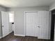 Bright bedroom with new flooring and ample closet space at 345 Forest Valley Rd, Lawrenceville, GA 30046