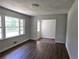 Spacious living room with hardwood floors and large windows at 345 Forest Valley Rd, Lawrenceville, GA 30046