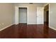 Bright bedroom featuring hardwood floors and a large closet at 1635 River Main Ct, Lawrenceville, GA 30044