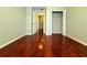 Well-lit bedroom featuring hardwood floors and a large closet at 1635 River Main Ct, Lawrenceville, GA 30044