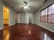 Hardwood floor bedroom with ceiling fan and ensuite bathroom at 1635 River Main Ct, Lawrenceville, GA 30044