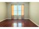 Bedroom with hardwood floors and neutral wall colors at 1635 River Main Ct, Lawrenceville, GA 30044