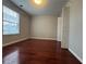 Bedroom with hardwood floors and large window at 1635 River Main Ct, Lawrenceville, GA 30044