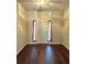 Entryway with dark wood floors and a light-colored door at 1635 River Main Ct, Lawrenceville, GA 30044