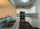 Kitchen with granite countertops and stainless steel appliances at 1635 River Main Ct, Lawrenceville, GA 30044