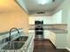 Kitchen with granite countertops and stainless steel appliances at 1635 River Main Ct, Lawrenceville, GA 30044