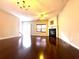 Living room with hardwood floors, fireplace and sliding glass doors at 1635 River Main Ct, Lawrenceville, GA 30044