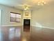 Spacious living room with hardwood floors, fireplace, and chandelier at 1635 River Main Ct, Lawrenceville, GA 30044