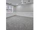 Finished basement with grey carpet and wainscoting at 295 Creekview Trl, Fayetteville, GA 30214