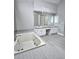 Bathroom boasts a large soaking tub and double vanity at 295 Creekview Trl, Fayetteville, GA 30214