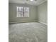 Spacious bedroom with neutral walls and carpet at 295 Creekview Trl, Fayetteville, GA 30214