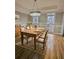 Dining room features hardwood floors and a farmhouse table at 295 Creekview Trl, Fayetteville, GA 30214