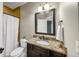 Bathroom with granite countertop, dark wood cabinets and shower/tub combo at 3633 Habersham Rd, Atlanta, GA 30305