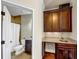 Bathroom with a wet bar, granite countertop and dark wood cabinets at 3633 Habersham Rd, Atlanta, GA 30305