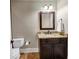 Clean bathroom with granite countertop and dark wood vanity at 3633 Habersham Rd, Atlanta, GA 30305