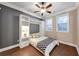 Cozy bedroom with built-in shelving and a ceiling fan at 3633 Habersham Rd, Atlanta, GA 30305