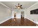 Hardwood floor bedroom with access to bathroom and staircase at 3633 Habersham Rd, Atlanta, GA 30305