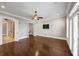 Bright bedroom with hardwood floors, access to bathroom and staircase at 3633 Habersham Rd, Atlanta, GA 30305