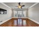 Spacious bedroom with hardwood floors, plantation shutters, and a ceiling fan at 3633 Habersham Rd, Atlanta, GA 30305