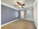 Spacious bedroom with neutral walls, ceiling fan, and window shutters at 3633 Habersham Rd, Atlanta, GA 30305